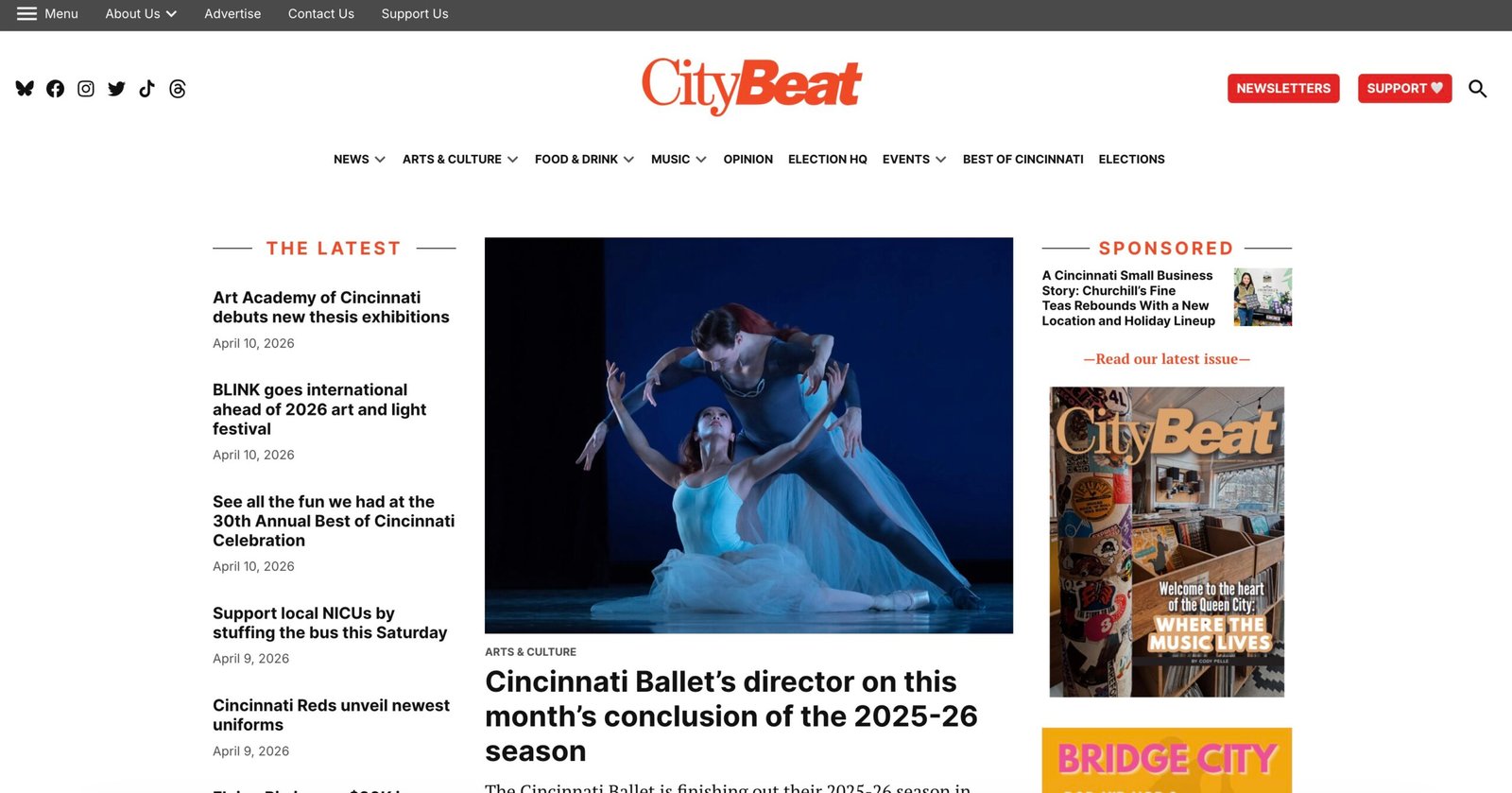 Local reporter taking notes and photographing a city event